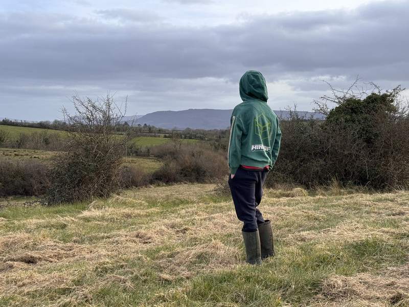 A young person looking out over the west Fermanagh landscape